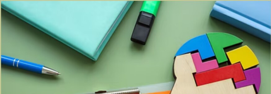 An IEP folder beside colorful learning pieces